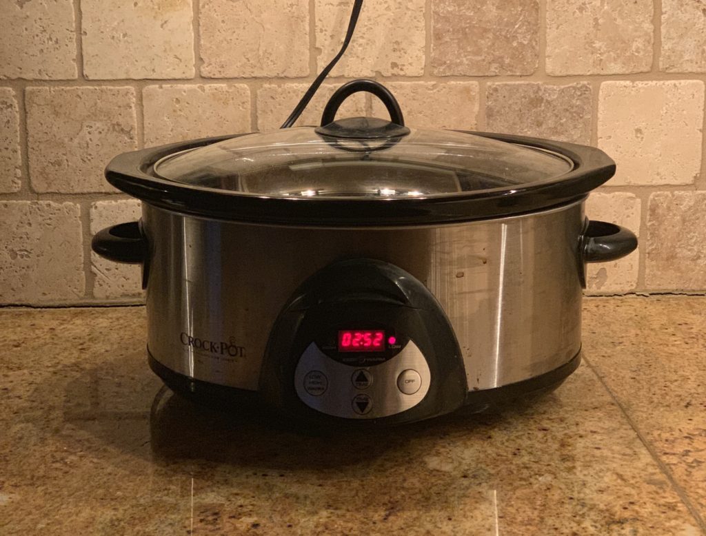 the lazy slow cooker sitting on a counter