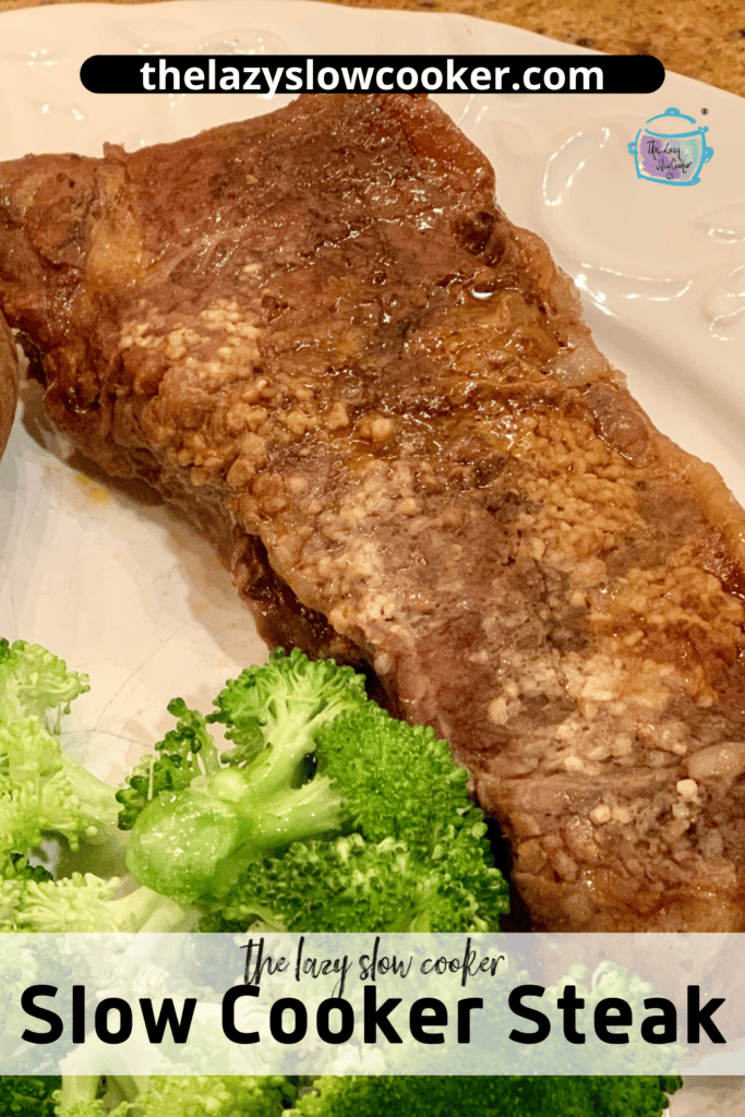 slow cooker steak on a white plate with broccoli and a baked potato