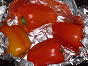 raw peppers in pot lined with foil