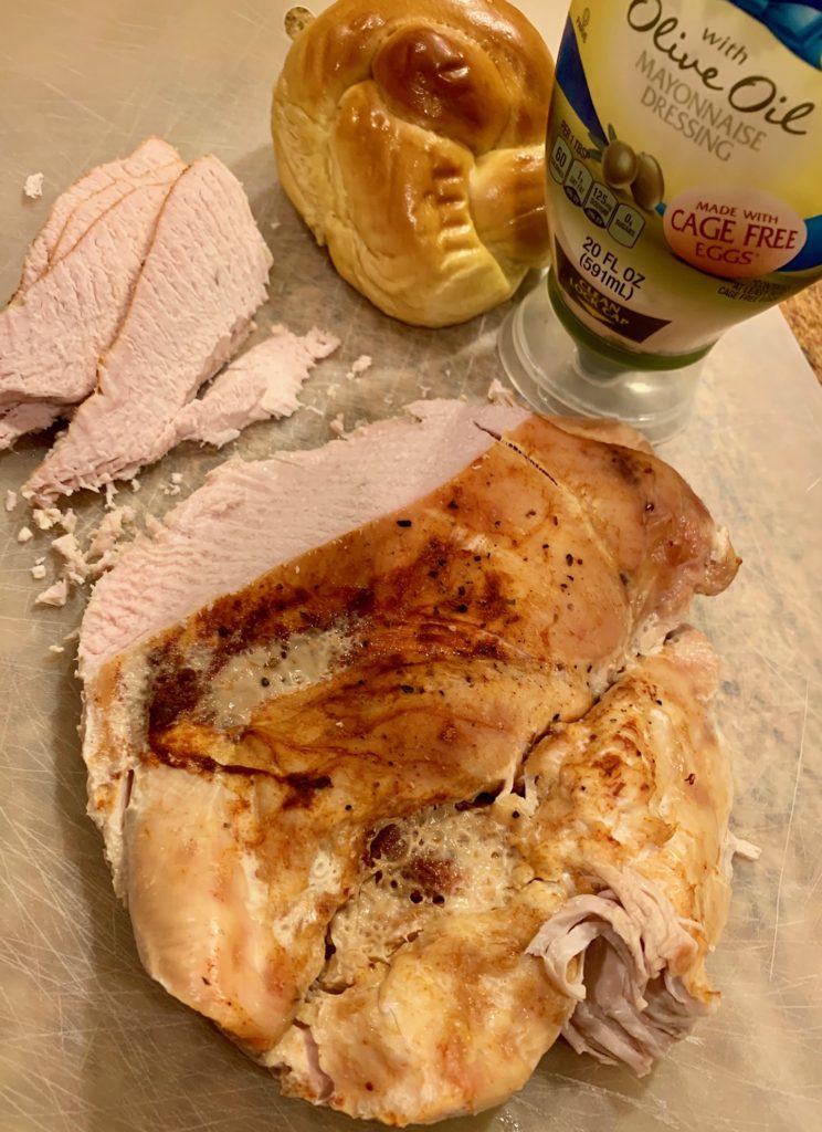 roasted turkey breast with a few slices taken