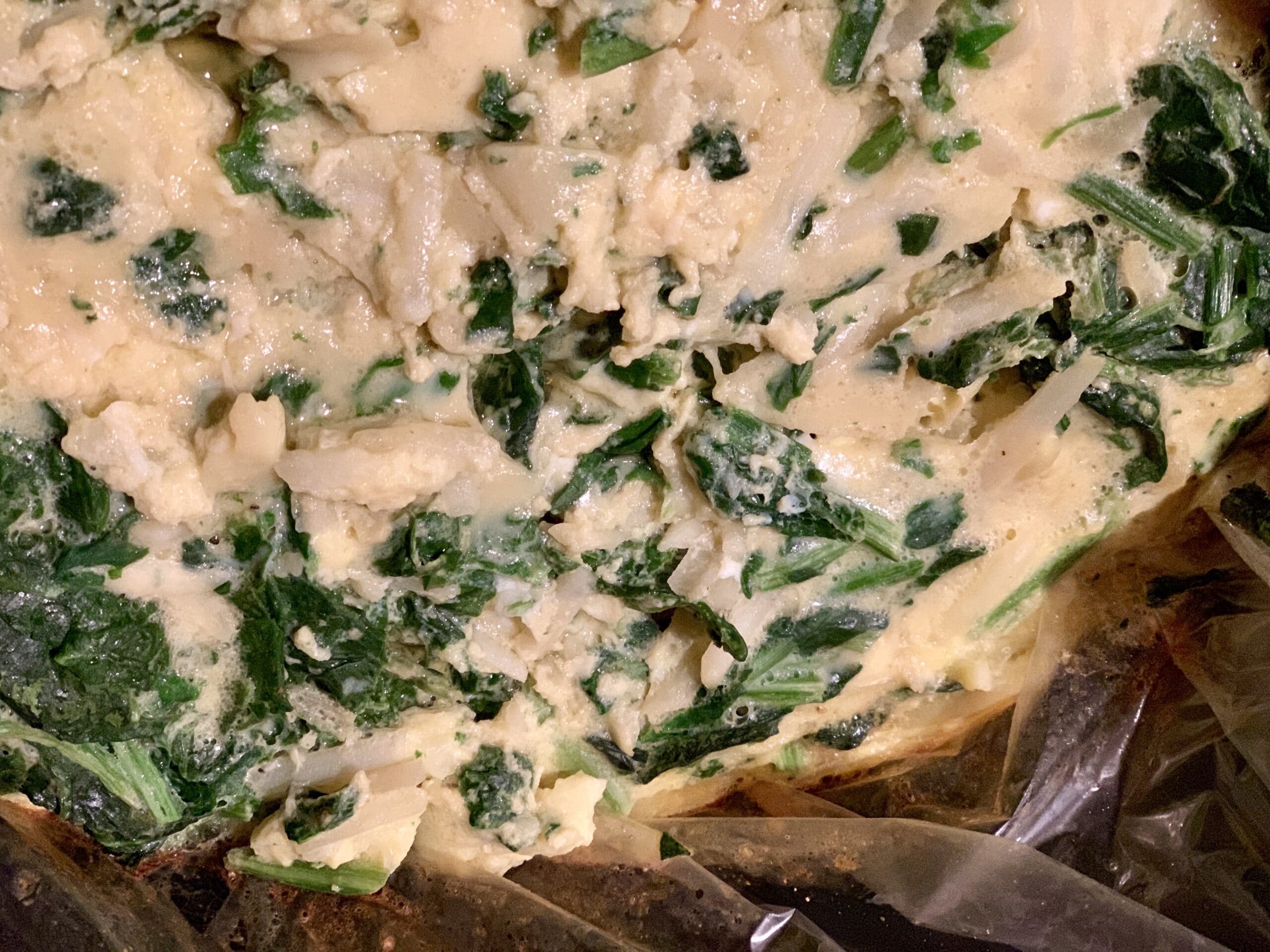 cooked frittata of eggs spinach and potato