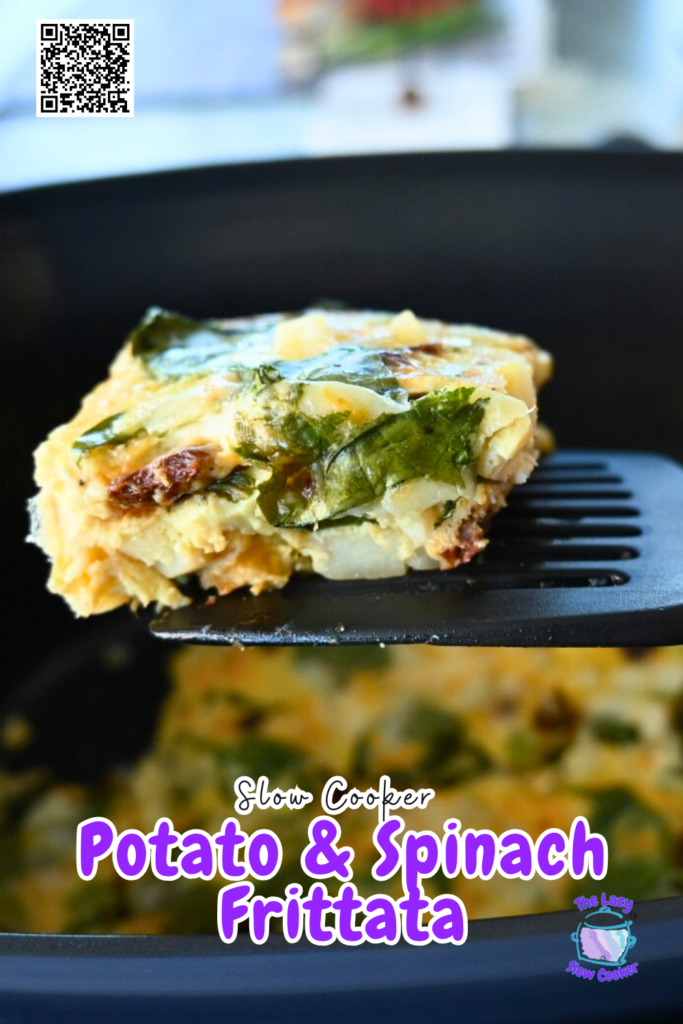 A close-up of a spatula lifting a square piece of spinach and cheese egg casserole from a black slow cooker, with more casserole visible inside the cooker.