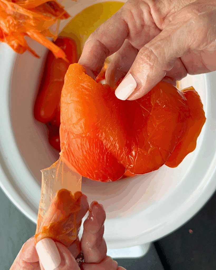 peeling the skin off a pepper