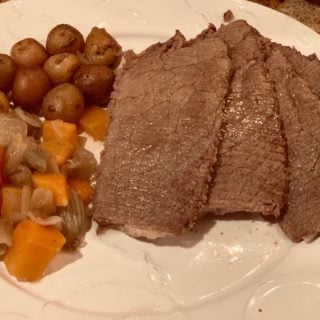 Roast, potatoes and. Veggies plated