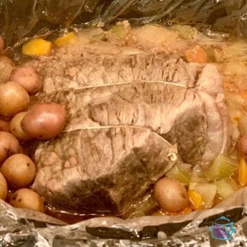 close up of beef potatoes and veggies in slow cooker