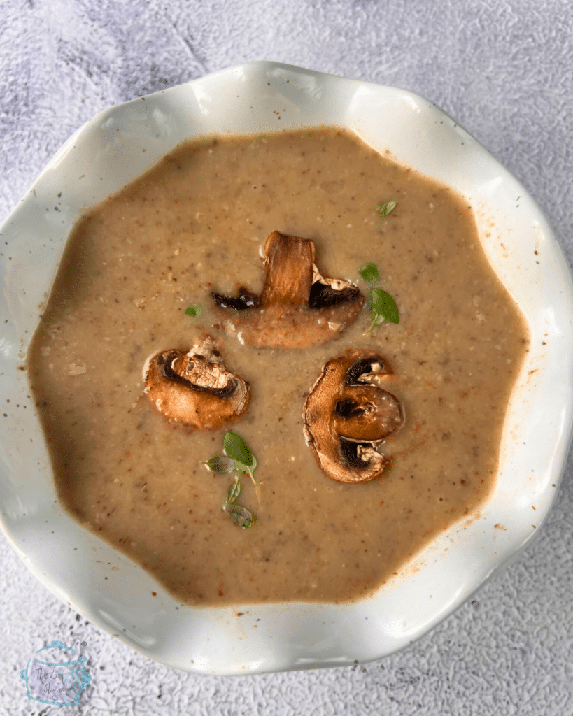 looking down on a bowl full of dairy free cream of mushroom soup made in a slow cooker