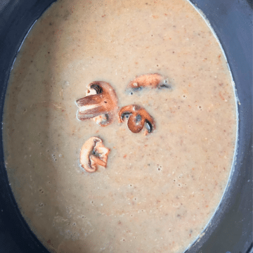 a crockpot full of cream of mushroom soup made with dairy ingredients