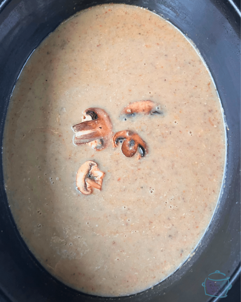 a crockpot full of cream of mushroom soup made with dairy ingredients