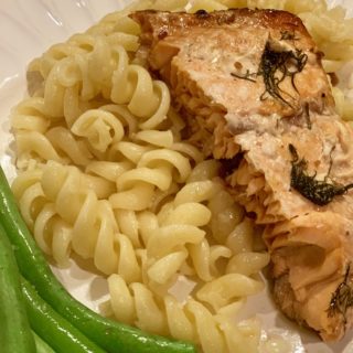 Salmon on plate with pasta and green beans