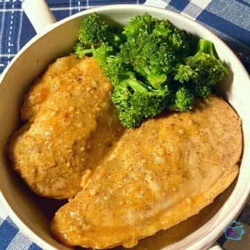 Two pieces of honey mustard chicken in a bowl with broccoli