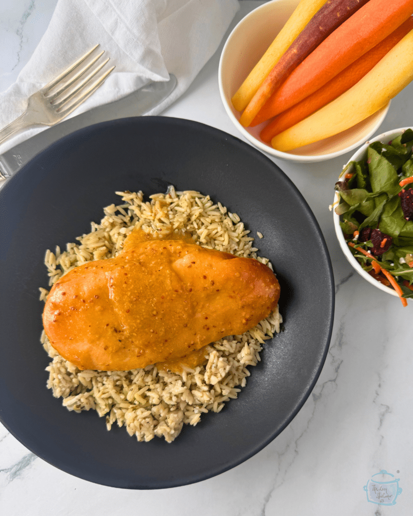 slow cooker honey mustard chicken on a bed of rice