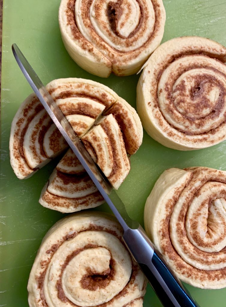 Cutting cinnamon rolls in quarters