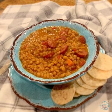 Lentil Hot dog soup ready to be served with crackers