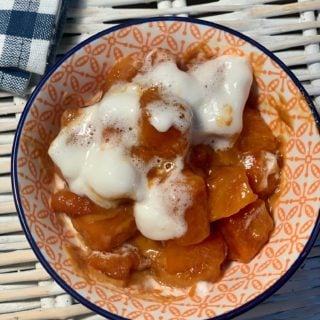 Bowl full of lazy slow cooker candied sweet potato