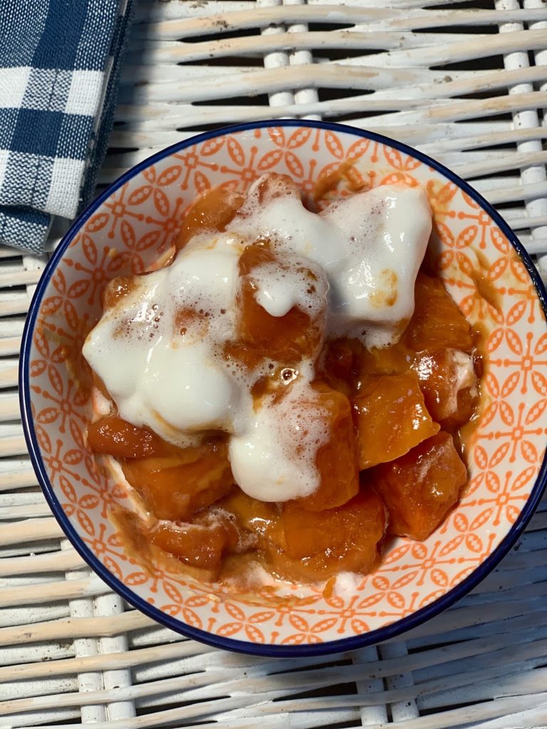 Bowl full of lazy slow cooker candied sweet potato