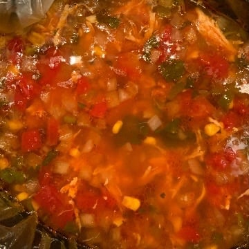 Close up of soup in crockpot before being fully cooked 