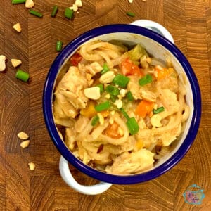 Looking down on a bowl of Thai Peanut Chicken with noodles