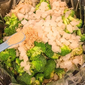 Broccoli, onion and spices in slow cooker