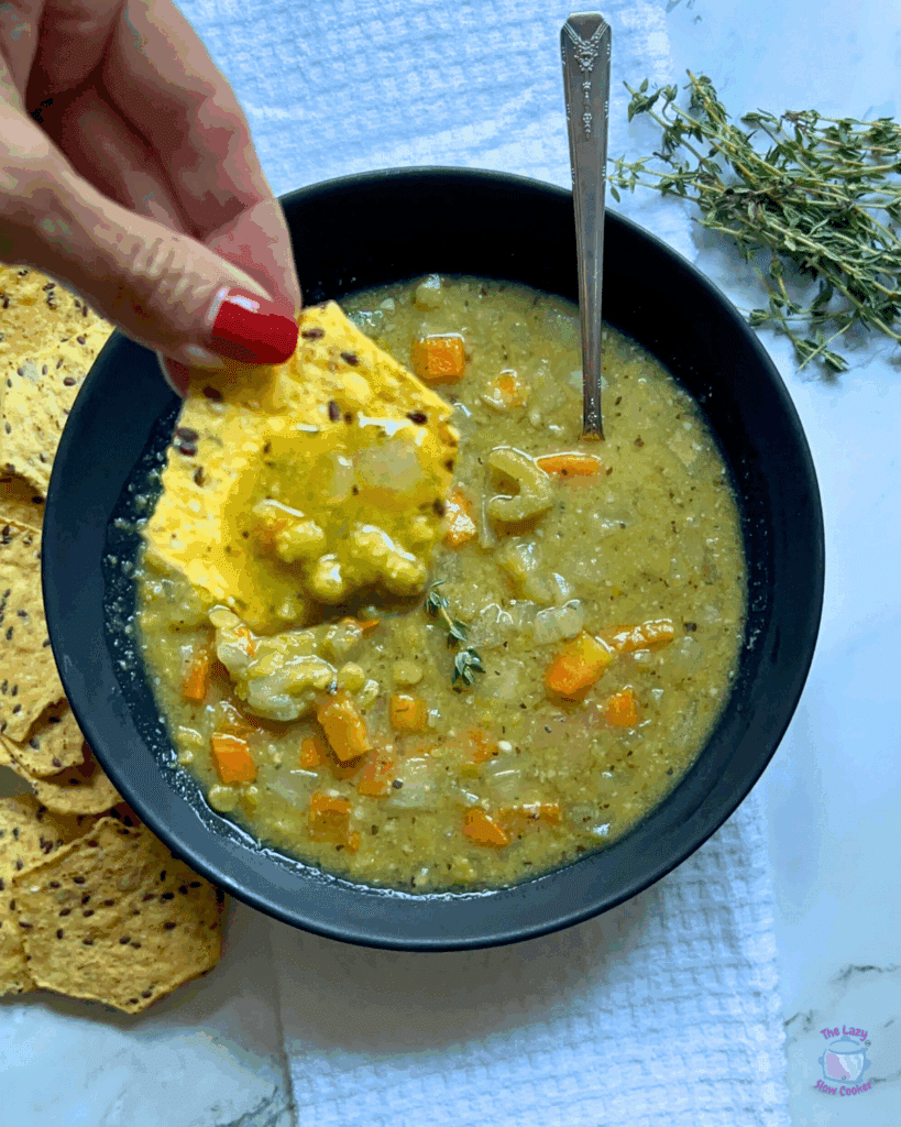 a round bowl with a spoon containing slow cooke