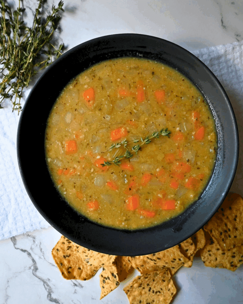 a round bowl with a spoon containing vegan crockpot pea soup