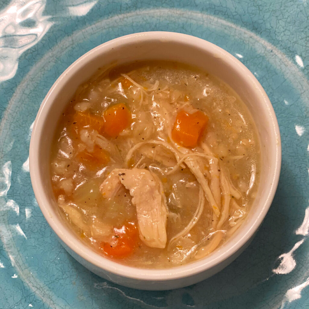 Top view of soup with chicken and beget