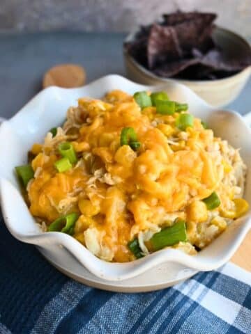 slow cooker chili chicken casserole made from rotisserie chicken in a white bowl