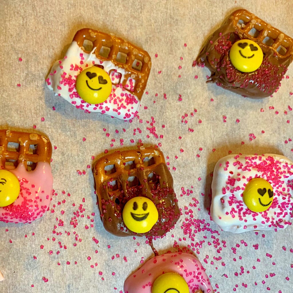 square pretzels dipped in chocolate with candy decoration