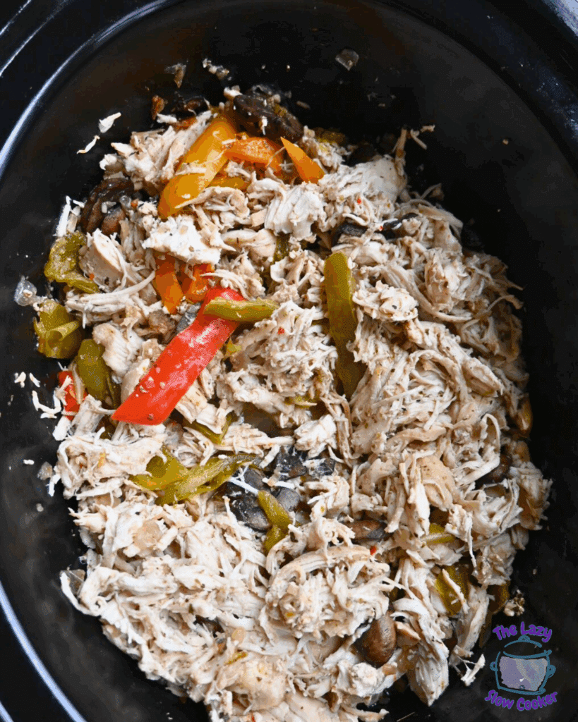 Cooked cheesesteak chicken still in crockpot