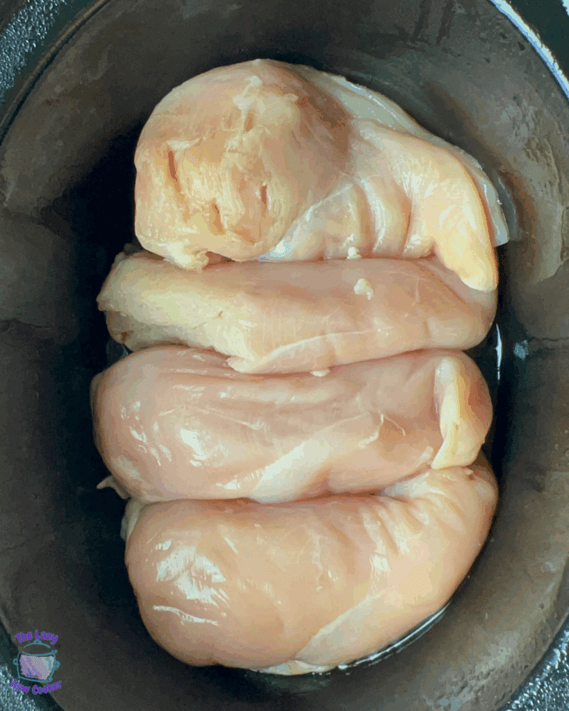 chicken breasts in a greased slow cooker