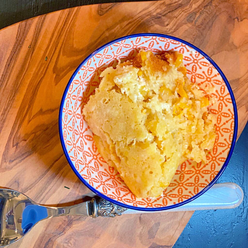 top view of this recipe in a round bowl with orange decor printed in side. 