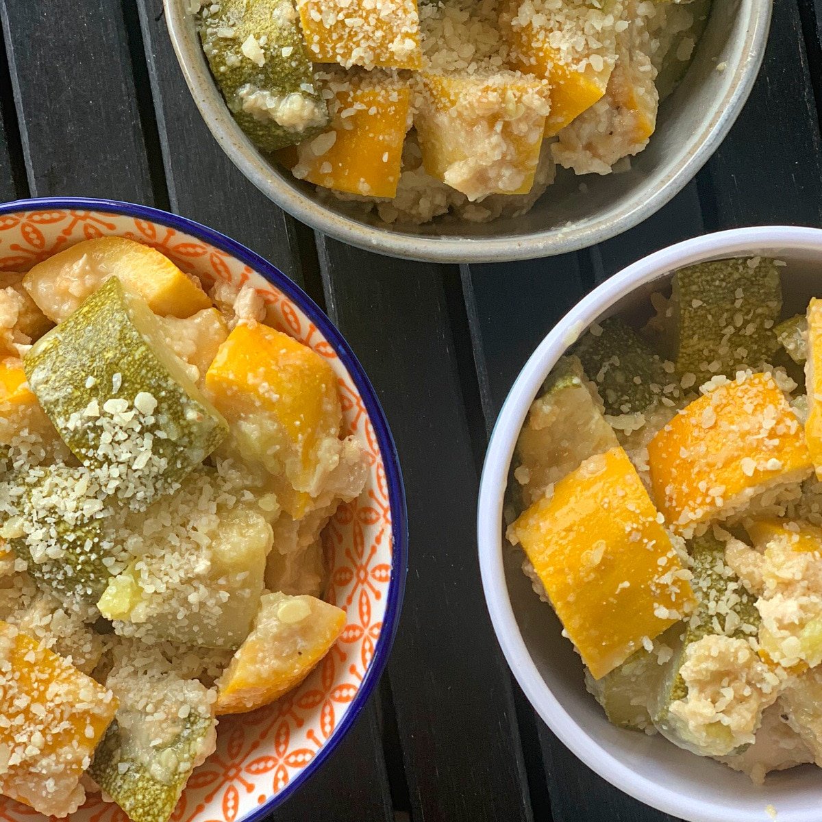 top view close up of three bowls of zucchini squash parmesan