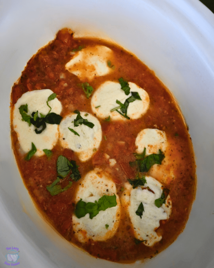 Finished caprese chicken in a slow cooker ready to serve