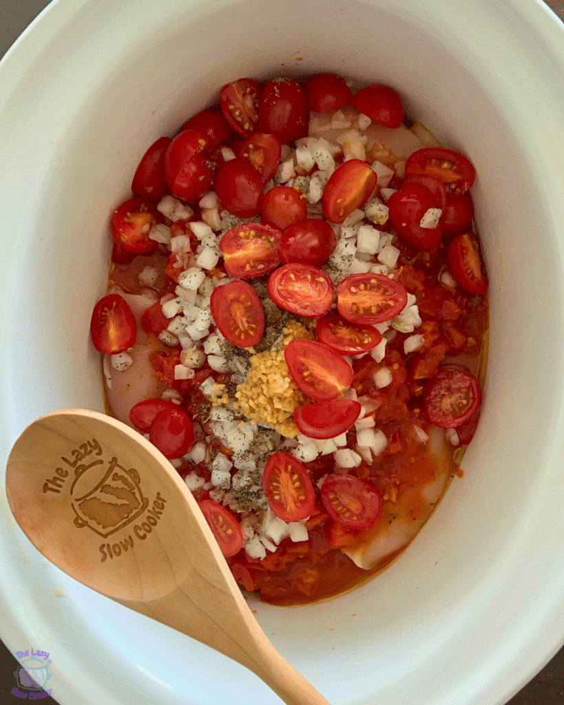 caprese chicken ingredients in slow cooker before cooking