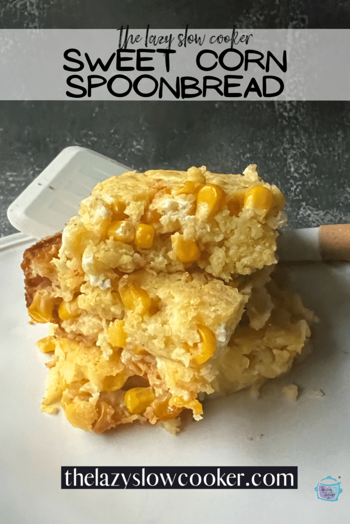 pieces of sweet corn spoonbread stacked on a white plate with a spatula.