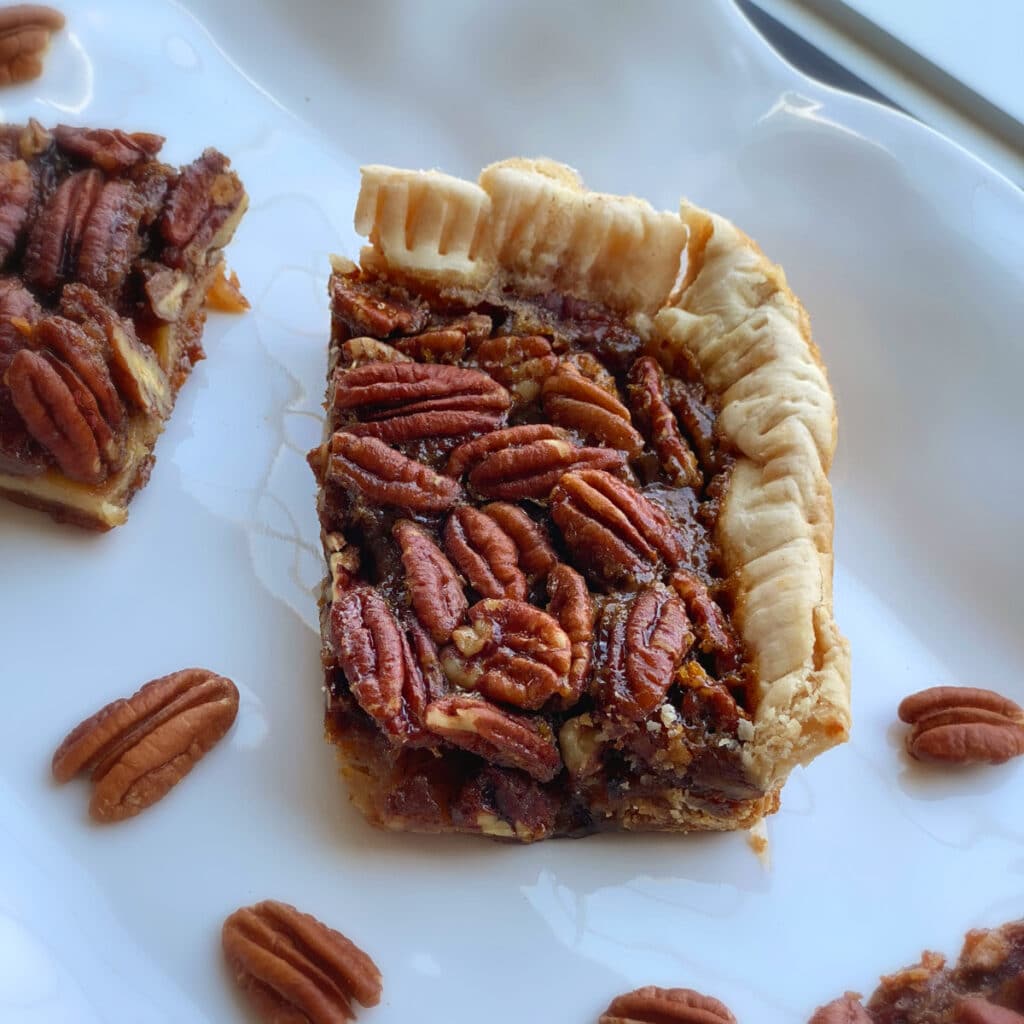 close up of a corner piece of crockpot pecan pie