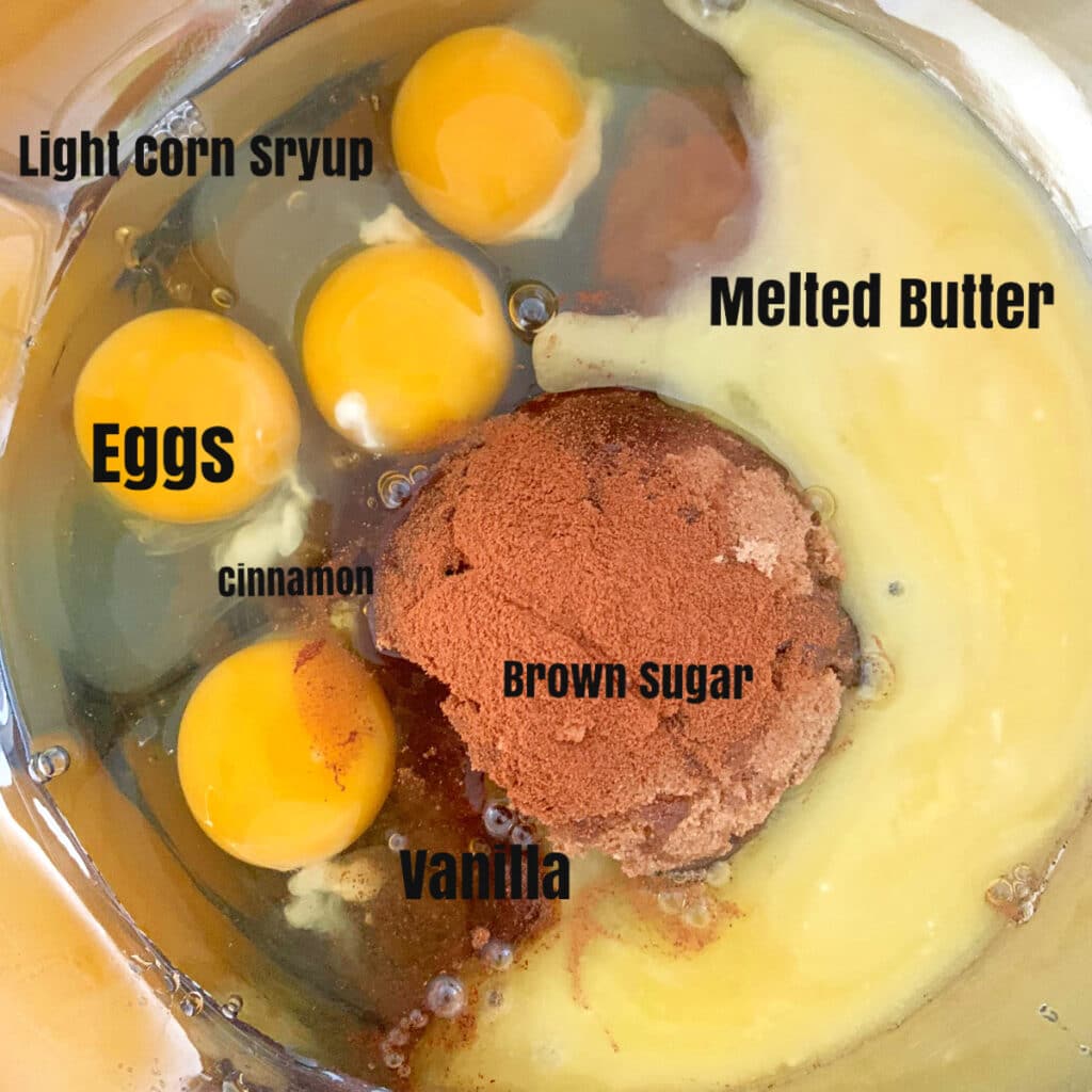 All ingredients other than nuts in a mixing bowl prior to mixing with labels