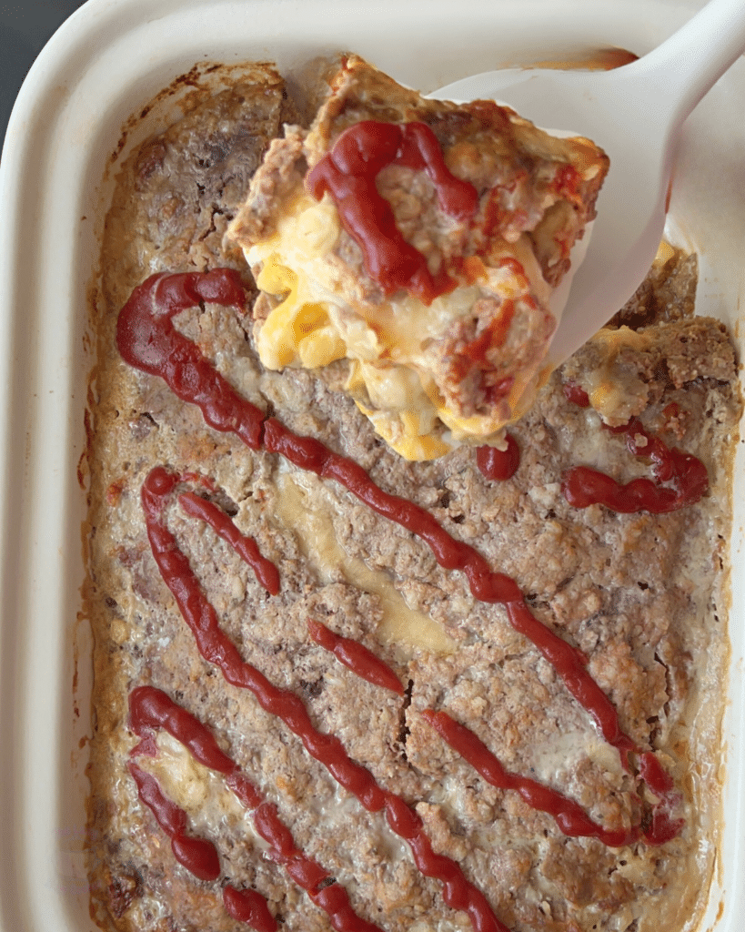 a finished slice of mac and cheese stuffed meatloaf on a spatula