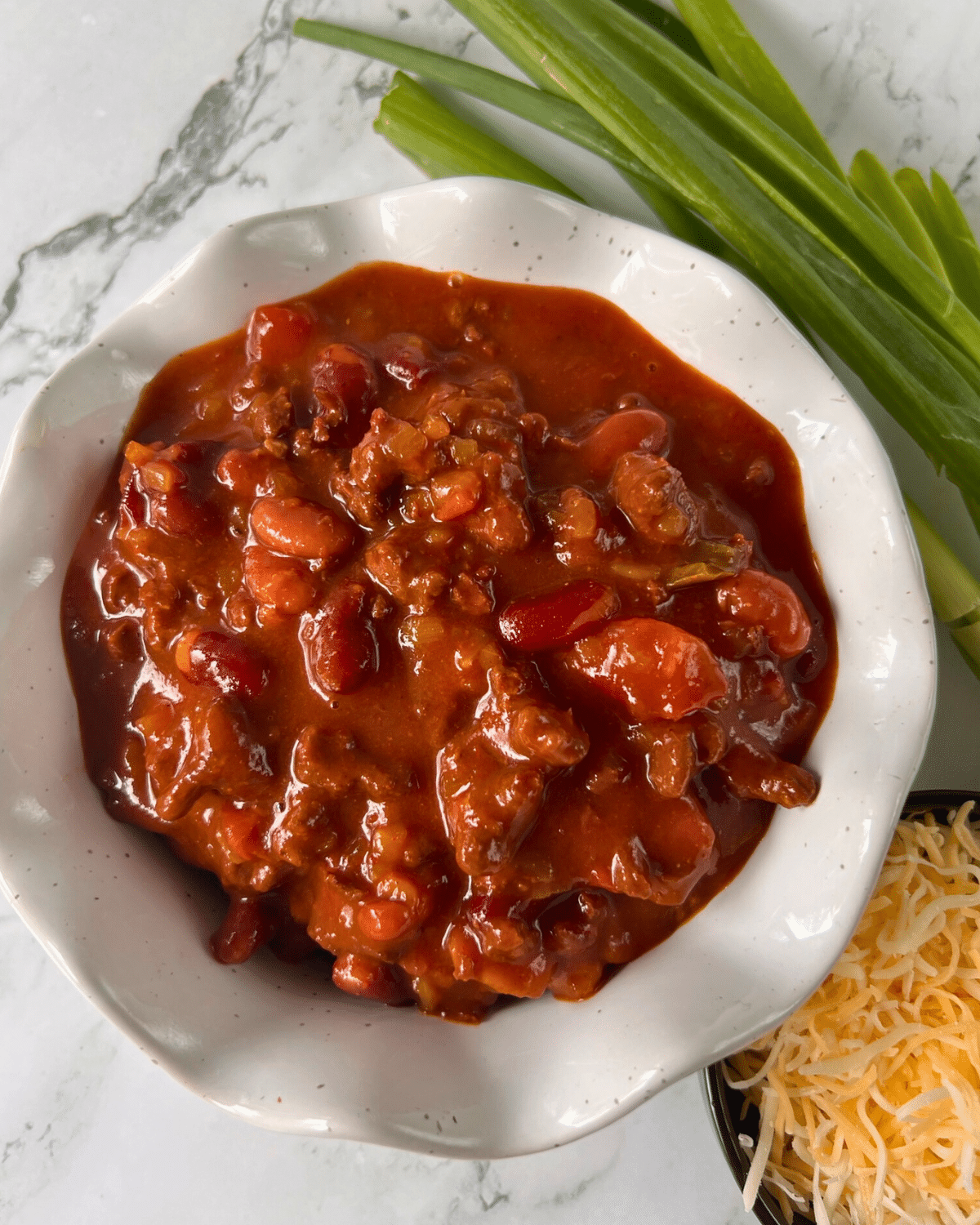 a while bowl filled with classic chili made in a slow cooker