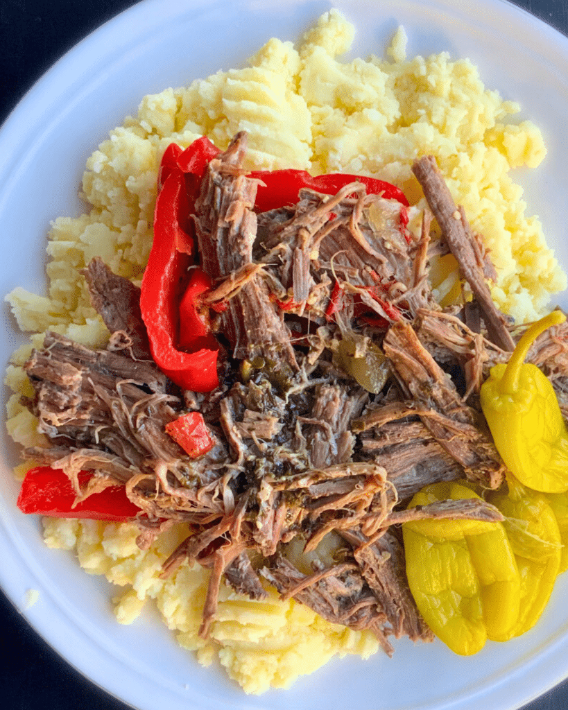 Shredded beef and peppers on a bed of mashed potatoes