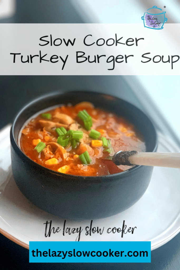 a black bowl on a window sill filled with slow cooker turkey burger soup