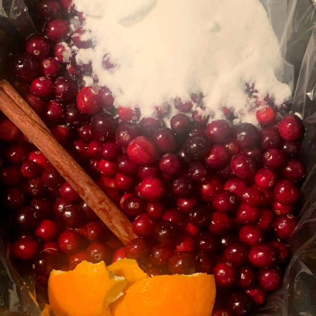 cranberry sauce ingredients in slow cooker prior to cooking