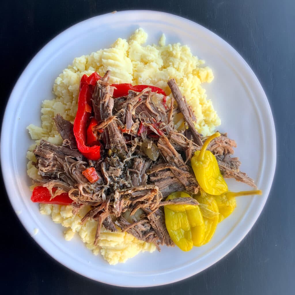 Shredded beef and peppers on a bed of mashed potatoes