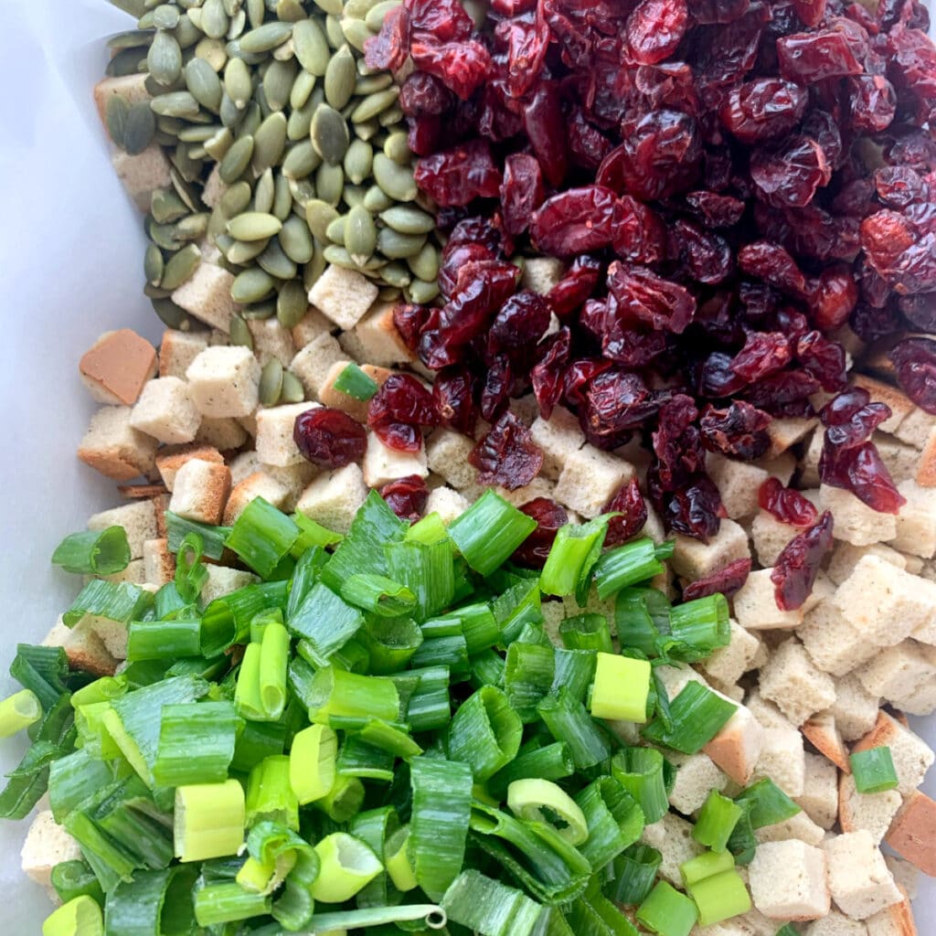 cranberries, pumpkin seeds, herbed bread cubes, sliced green onions