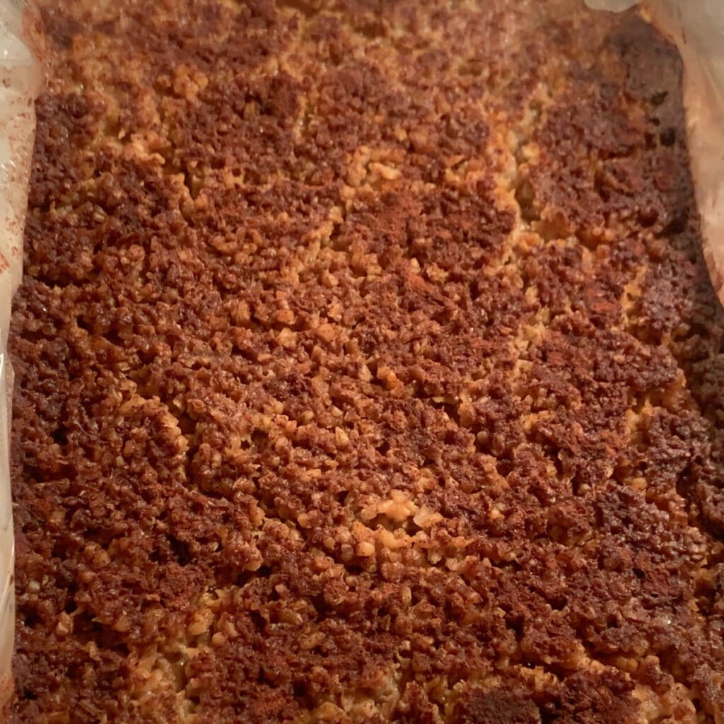 Close up of the top of gingerbread oatmeal after cooking overnight with a crusty, delicious looking top.