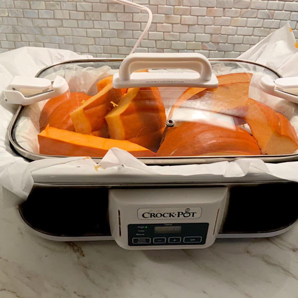 Cut up pumpkin in a slow cooker with the lid on while cooking