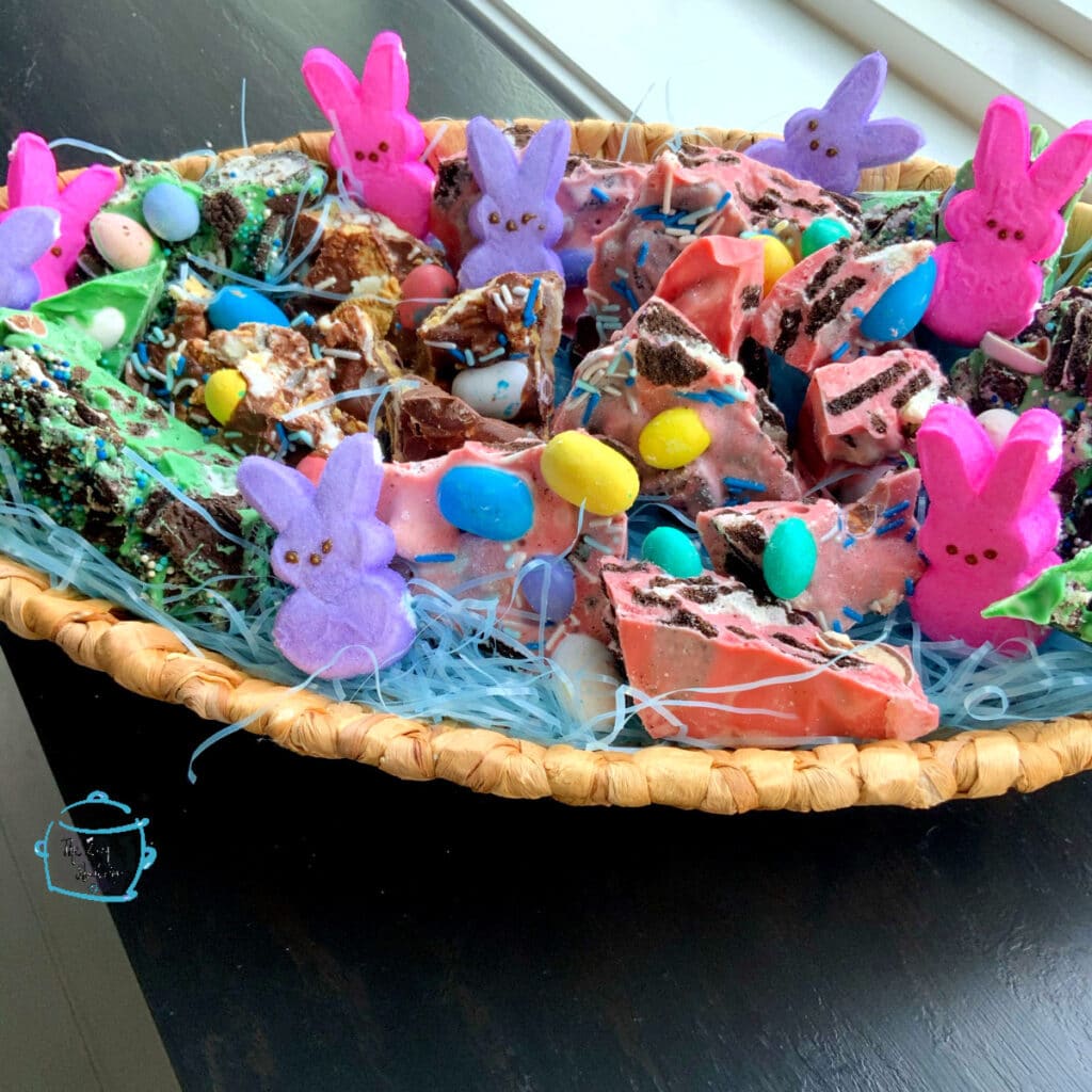 colorful bark and marshmallow bunnies in a basket decorated for Eater