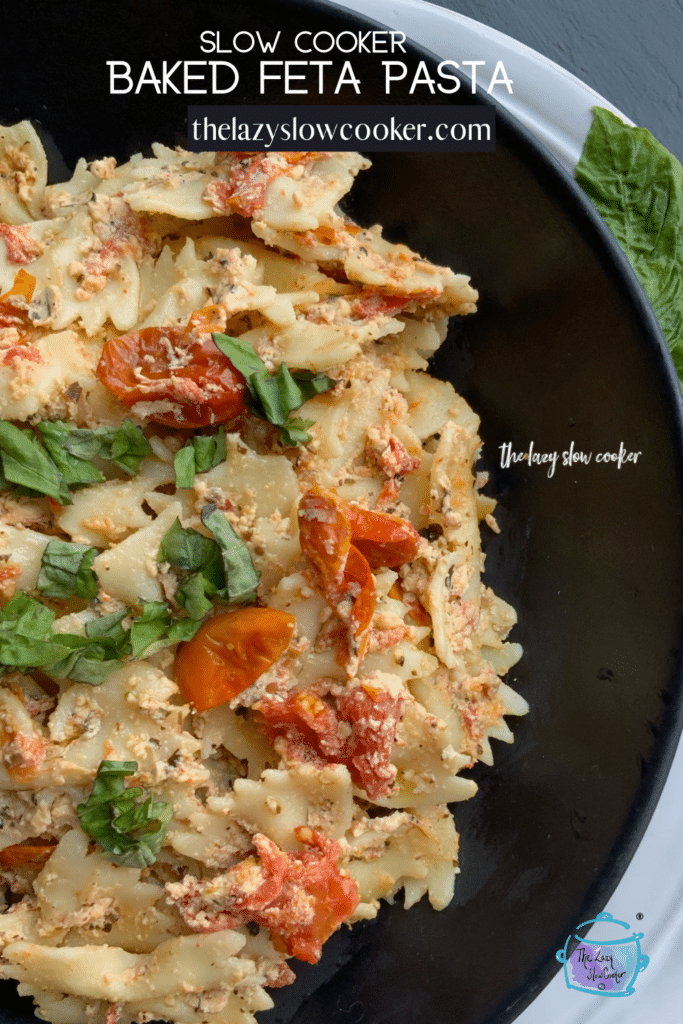 bow tie pasta with feta cheese and tomatoes cooked in a slow cooker and topped with fresh basil