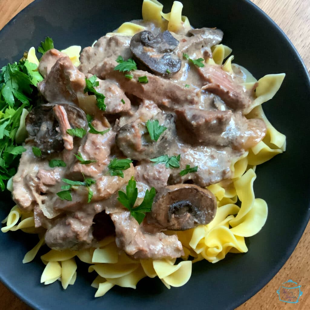 Close up of beef stroganoff with mushrooms and pasta