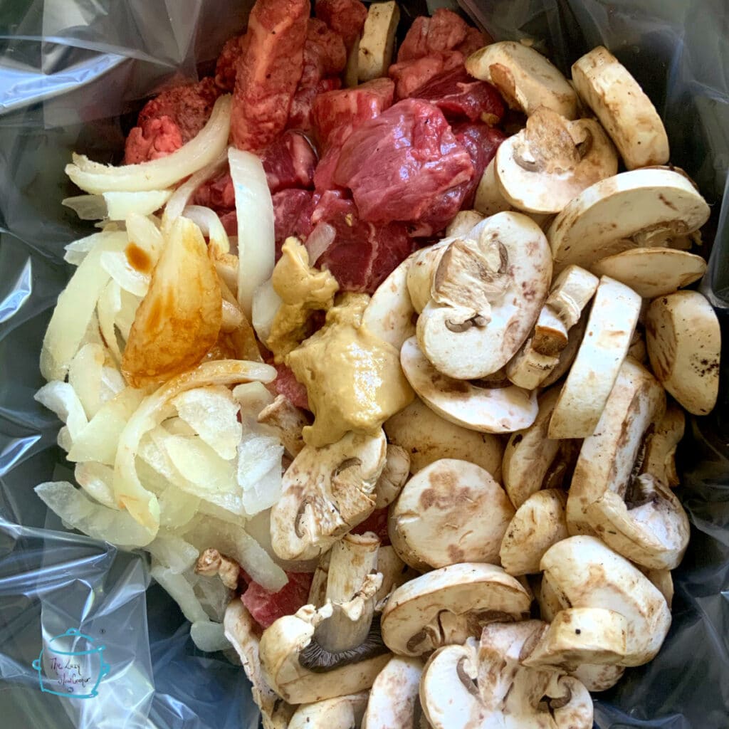 Mushrooms, onions, beef and spices in slow cooker