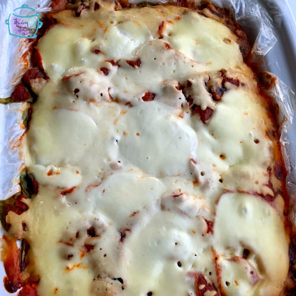 Finished slow cooker mushroom spinach lasagna still in crockpot